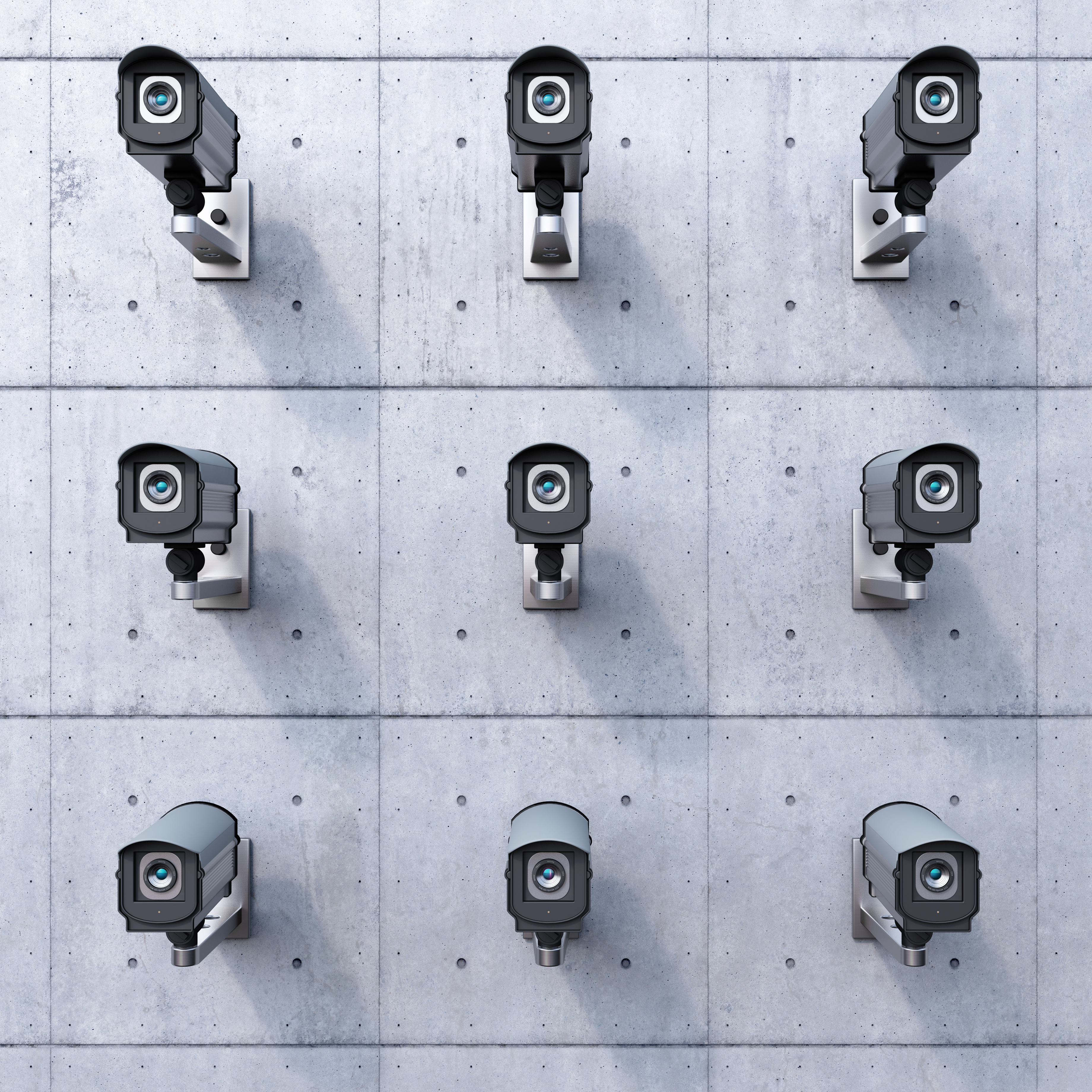 nine security cameras on a wall