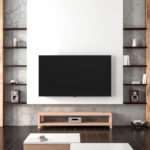 A flat screen tv hands on the wall of a modern living room